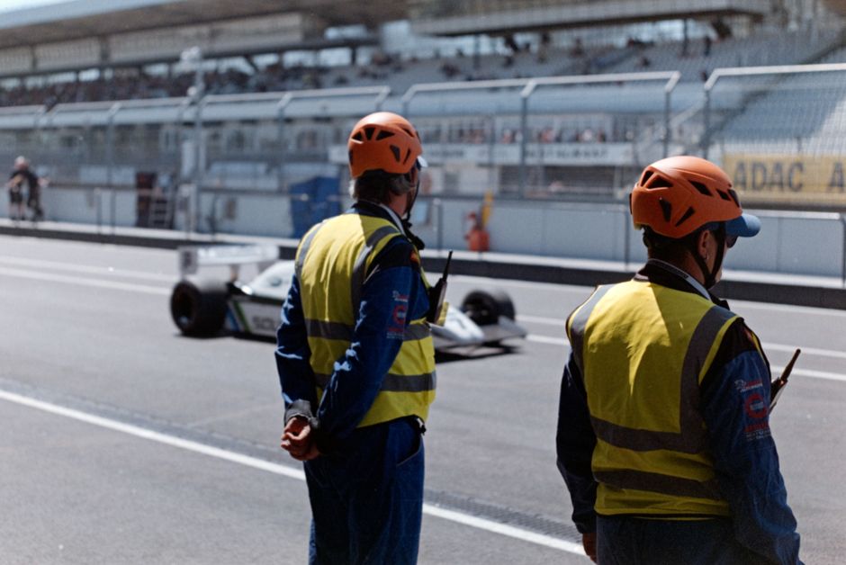 A motorsport pit lane and team